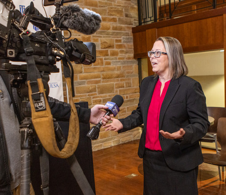 Sarah Hill speaking to interviewers