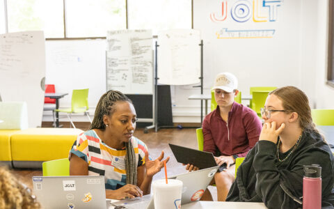 UTulsa JOLT Lounge: Students collaborating with laptops